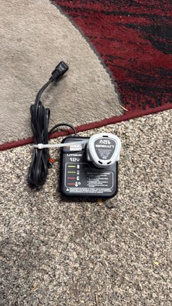 Black & Decker 12V Max Lithium-Ion Battery Charger (Model LCS12) with a compatible 12V lithium-ion battery.