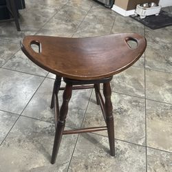 Saddle Seat Solid Wood Counter or Bar Stool - Backless. The stool is in good condition with some cosmetic blemishes. These blemishes are q from lite t
