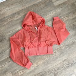 ALO Yoga Orange Hood Wind Jacket size M.
