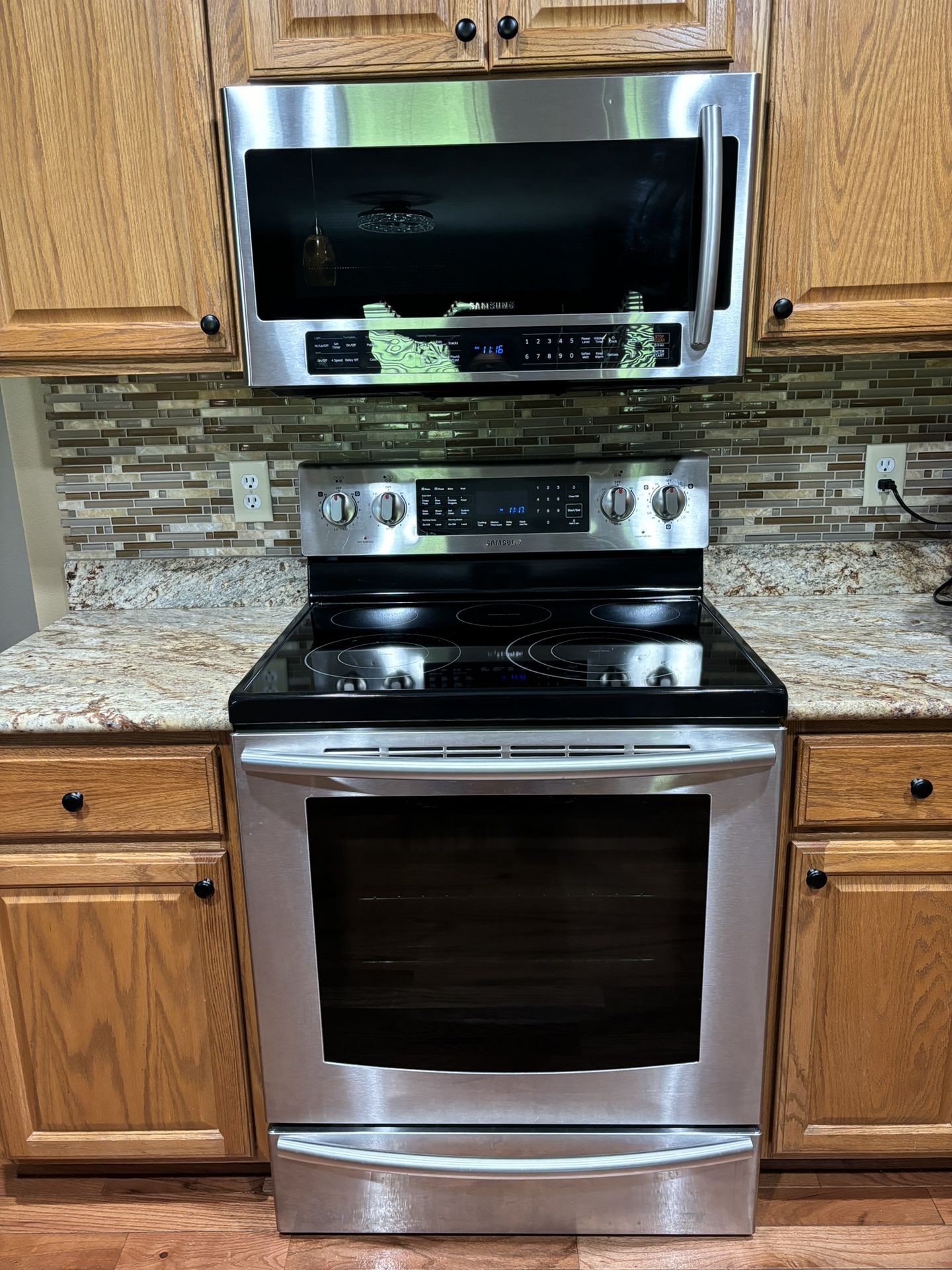 Samsung Glass Top Electric Stove & 2.1 Cu Ft Microwave