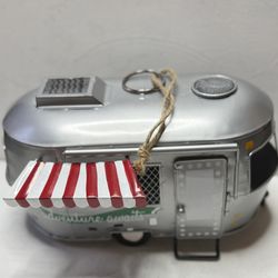 A vintage-style scale model of an Airstream camper