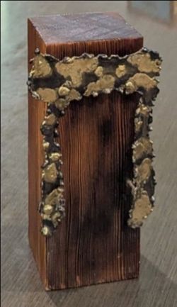 Brutalist-Style Hebrew Letter "Chet" (brass), nailed to wooden pillar