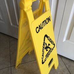 Rubbermaid Commercial Multilingual "Caution" Floor Sign Plastic 11 x 1 1/2 x 26
