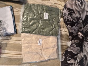 Two women’s sweaters, mystery