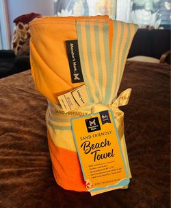 Members mark beach towel