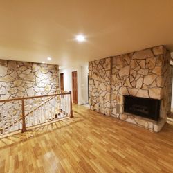 FIREPLACE F/P and stair wall stone going down