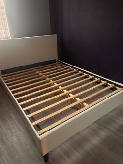 White faux leather queen bed frame with headboard