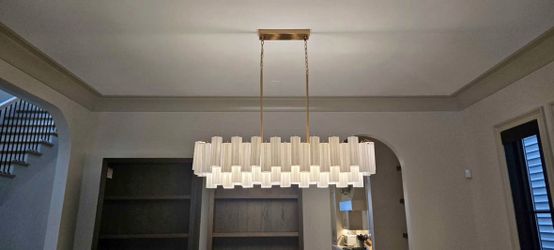 Crystorama Addis 51.75” Linear Chandelier – Aged Brass / White Glass