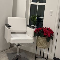 A white leather armchair for the living room or for a barber shop