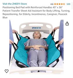 Positioning bed pad with handles
