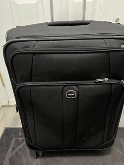 DELSEY DLX Softside Expandable Suitcase Luggage with 4 Wheels, Black, Size 27 Inch. Preowned very good condition .