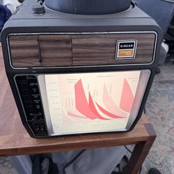 Singer Caramate 3300 slide projector with tape deck cassette for audio. dual purpose, projector, and viewer screen.