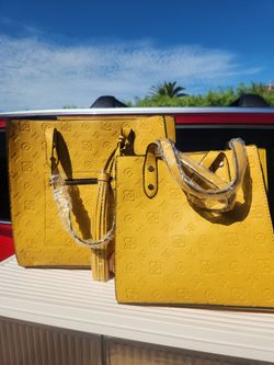 Set of yellow handbags