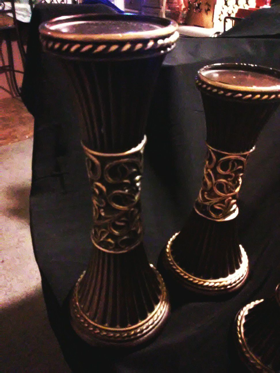 dark brown and gold Roman pillar type candle holders