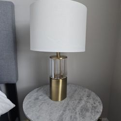 Gold and glass modern table lamp with white shade