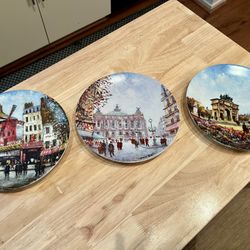 Vintage Limoges Louis Dali porcelain collector plates from the "Sights of Paris" series, set of 3.