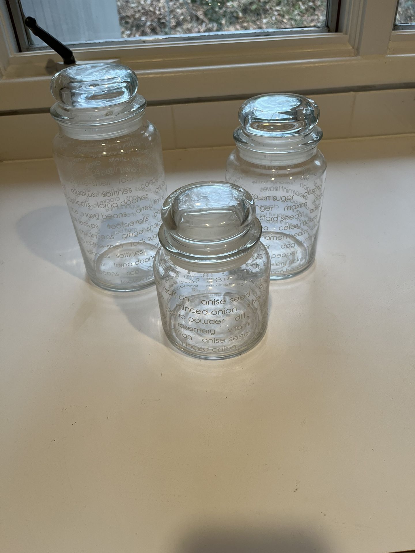 Three Glass Jars With Glass Tops