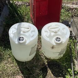 2 big containers of vinager