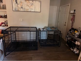 2 dog kennels. One for a huge dog the other for a smaller dog. Dog bowl dog bed and water dispenser