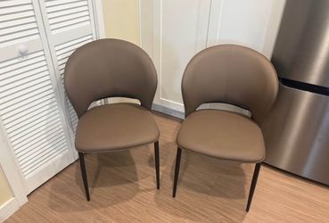 2 modern leather dining chairs