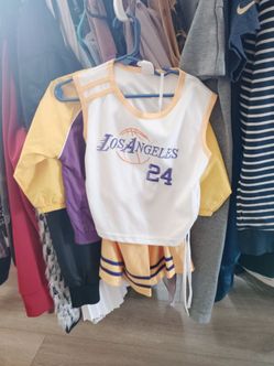 This is a children's Los Angeles Lakers basketball jersey and cheerleader skirt set, styled after player Kobe Bryant's number