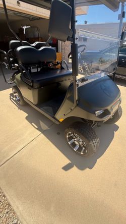 2021 Gas Ezgo Military/Olive golf cart. Nearly brand new condition.