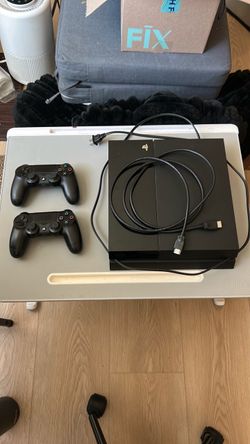 Sony PlayStation 4 Console with Two Controllers