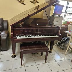 D.H. Baldwin C152 baby grand piano in a polished mahogany finish
