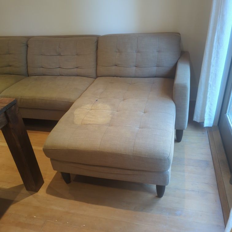 Very Comfortable Sectional With Stains 