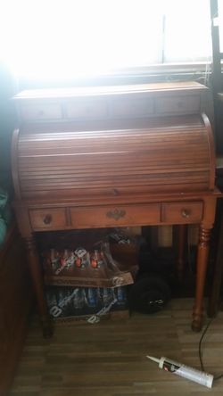 Brown wood rollo top dresser