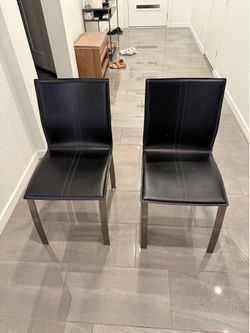 Two Leather-Backed Dining Chairs