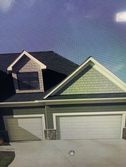 Sectional garage door/puerta de garage seccional
