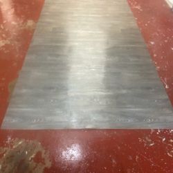 Laminate Flooring And Gallon Of Adhesive 12x6 flooring also comes with the bucket of glue. Retail is $60 for the glue. The glue was used one time.  No