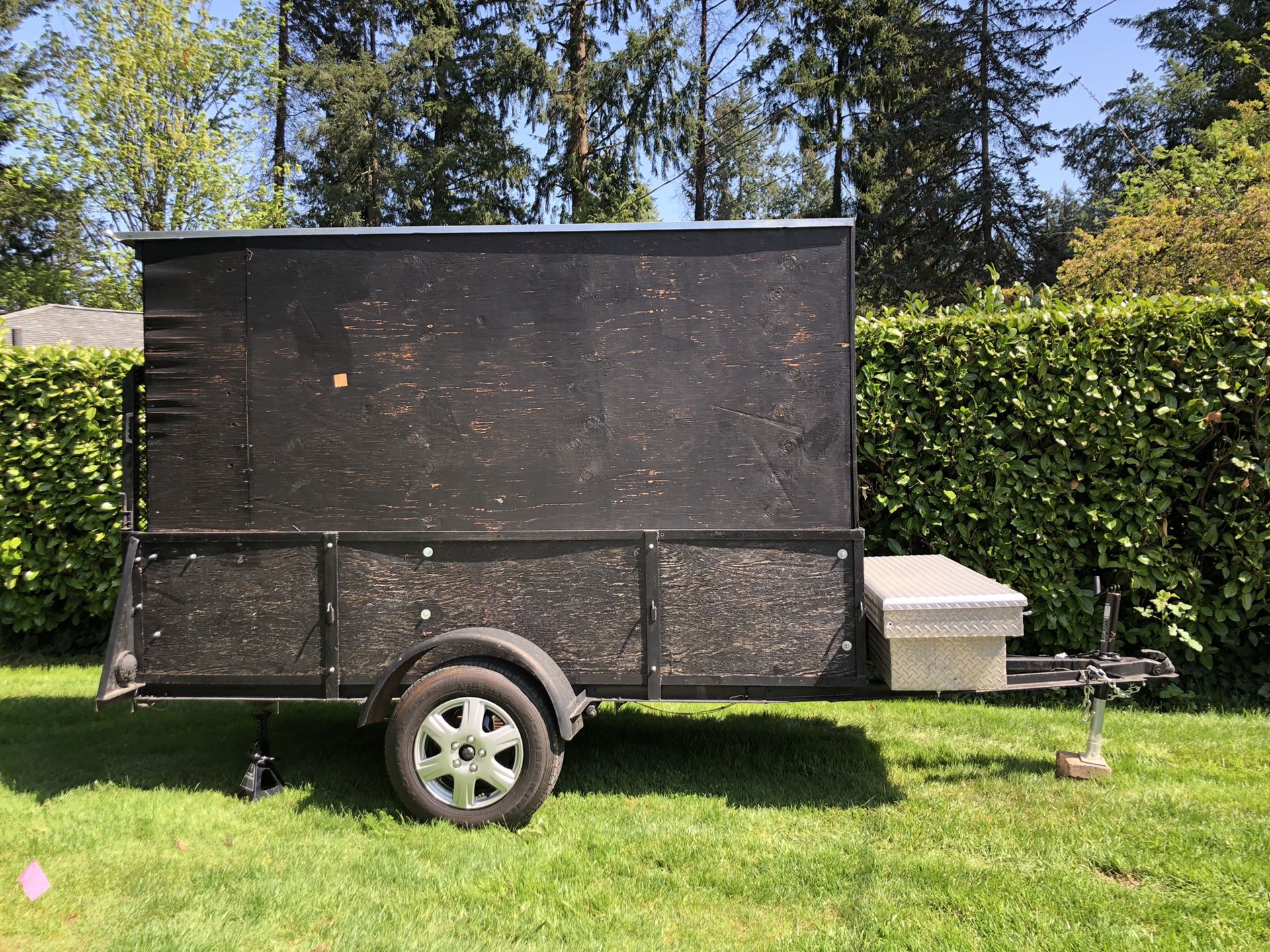 Covered modified utility trailer (enclosed cargo trailer)