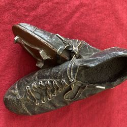 decorative figurine or statue of an adult's Victorian-style boot or shoe.
