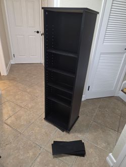 Black rotating/spinning wood shelving unit (16 shelves)