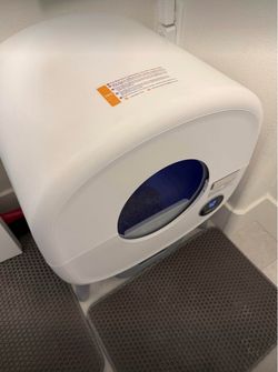 Modern automatic self-cleaning cat litter box in excellent like-new condition