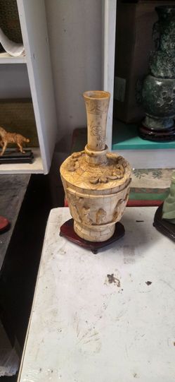 Antique vase and carved bovine bo ne