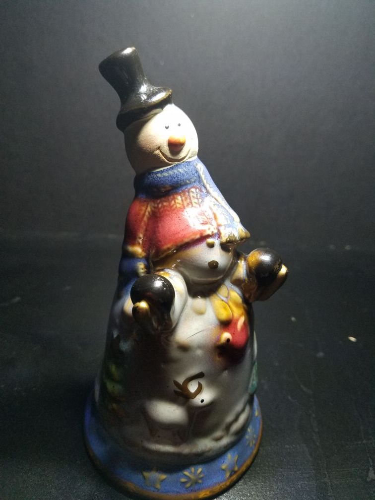Whimsical snowman on bell