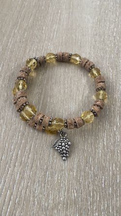 Elegant Yellow And Brown Beaded Bracelet With Silver Charm
