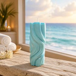 Hand poured one hundred percent , soy wax aquamarine , waves, ocean inspired candle