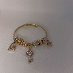 Elegant Gold Bracelet with Pink and Silver Charms