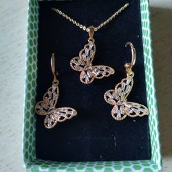 A Golden Set Of Pendant And Earrings With Artificial Gemstone And Rhinestone 