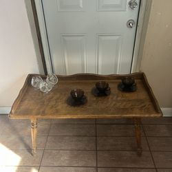 Beautiful solid wood vintage coffee table with tray-style raised edges.