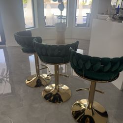 three Green Stools Adjustable For A Counter Height, And bar Height
