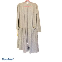 Lularoe Sarah gray light long duster cardigan NEW with tag. Size small. Approximately 40 inches long 19 inches armpit to armpit laying flat