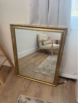Mirror with gold trim
