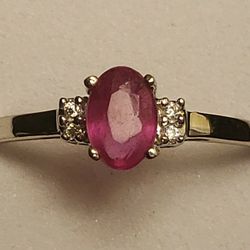 10kt white gold .55 carat oval cut African ruby with 4 diamond accents ring size 7