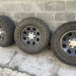 4 Black Chevy rim and tire