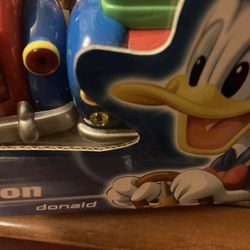 Mickey Mouse Figurine And Donald Duck Figurine Driving Their On Car D